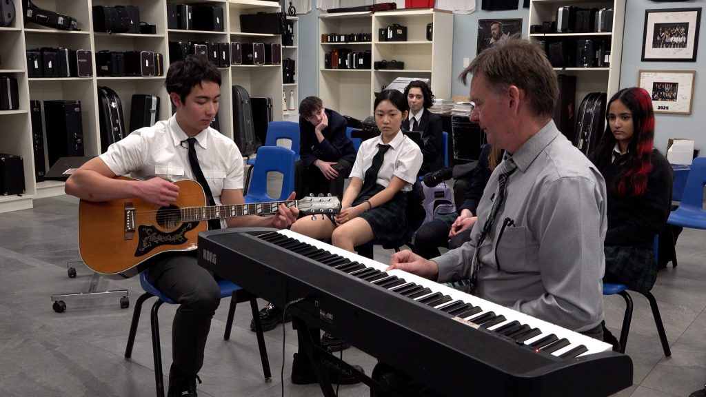 The students learn some song-writing techniques.